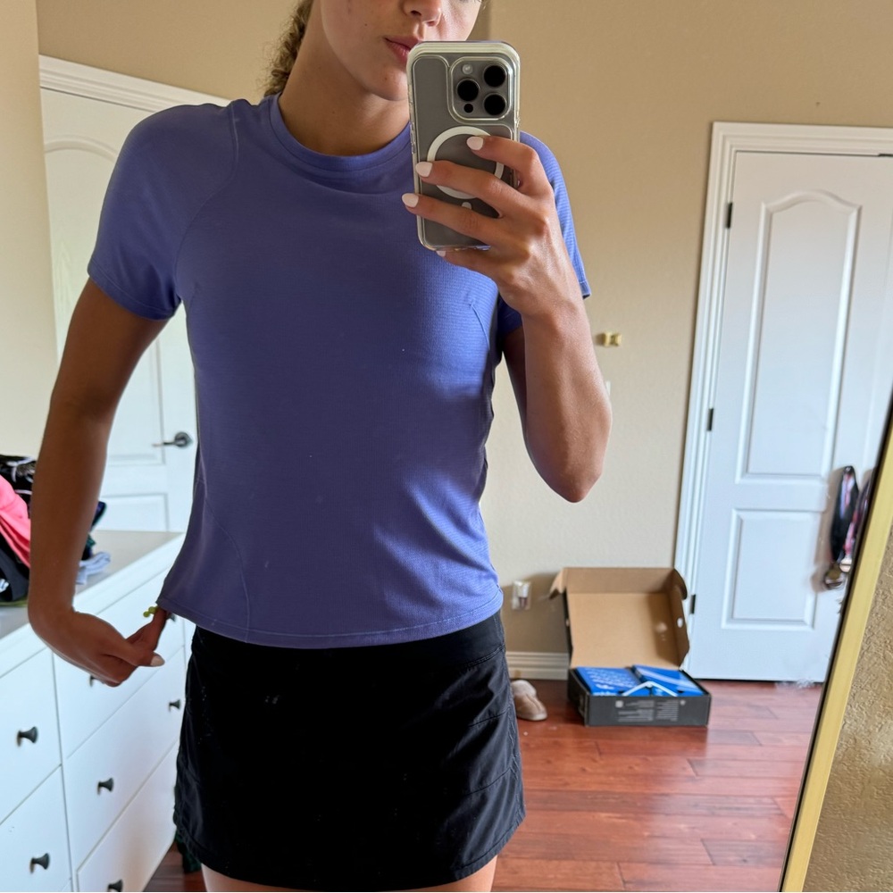 Lululemon purple shirt, size 4, in new condition